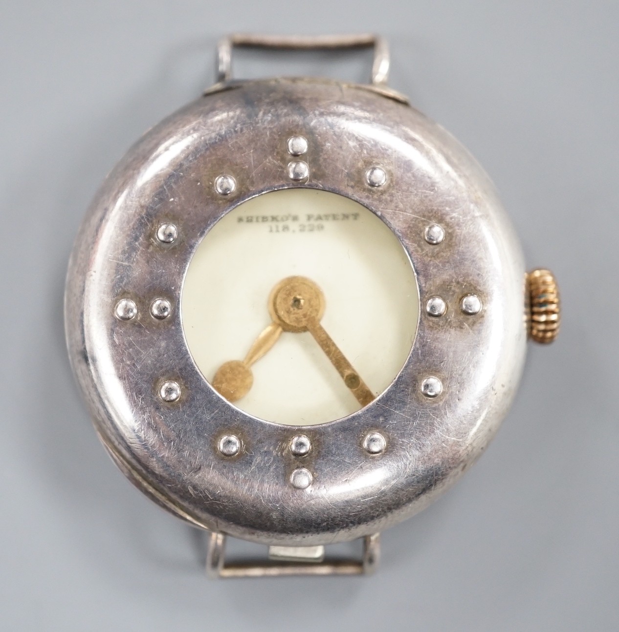 A gentleman's silver Shibko's patent Braille dial manual wind wrist watch, no strap.